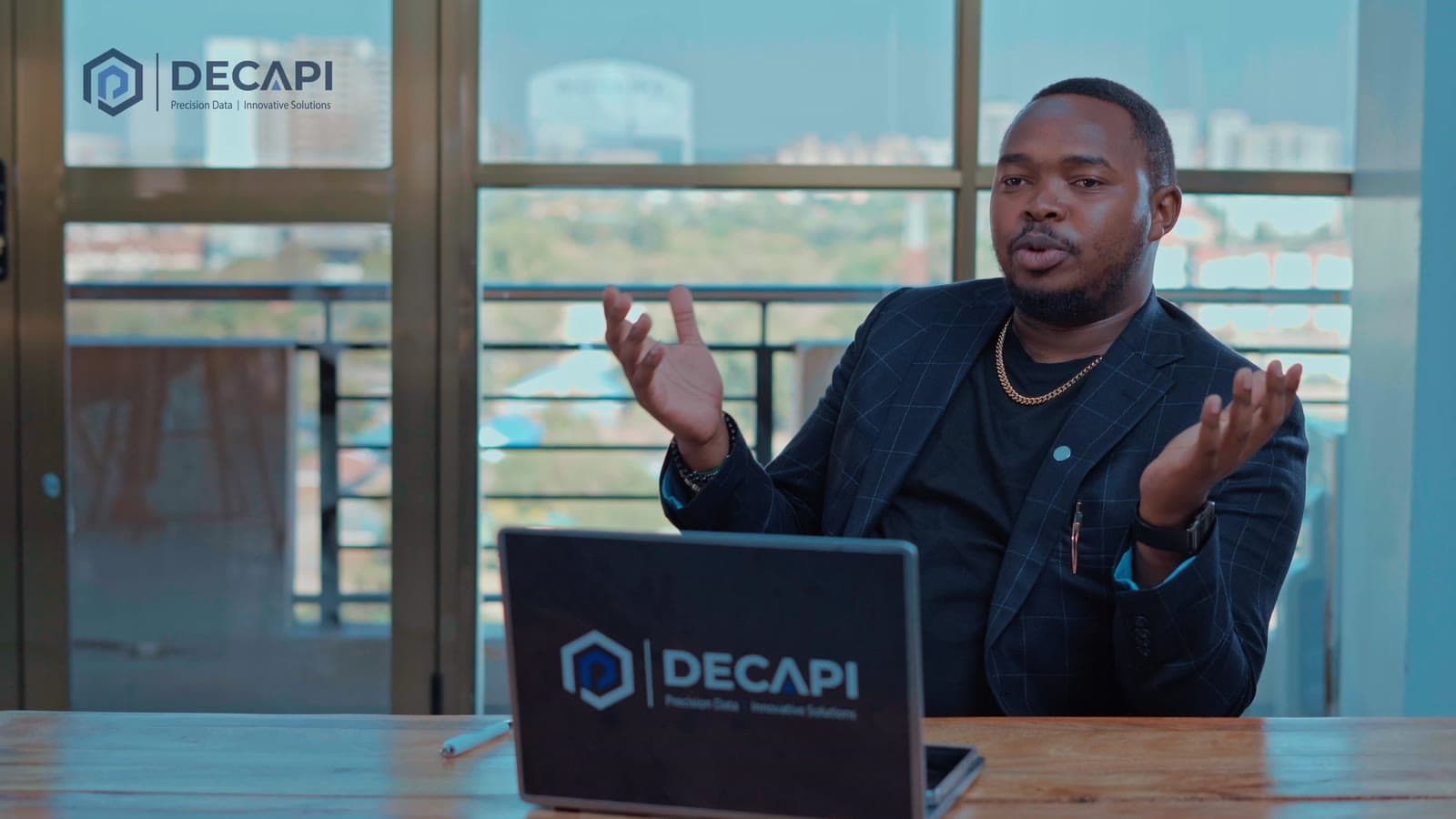 Joshua Mwaura in conversation at the DECAPI office